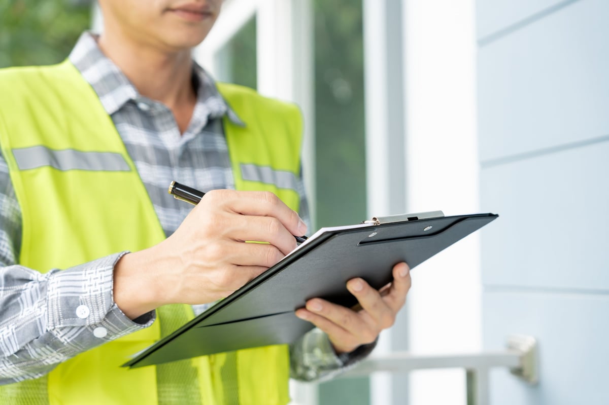 Engineer inspecting a newly built house before handover