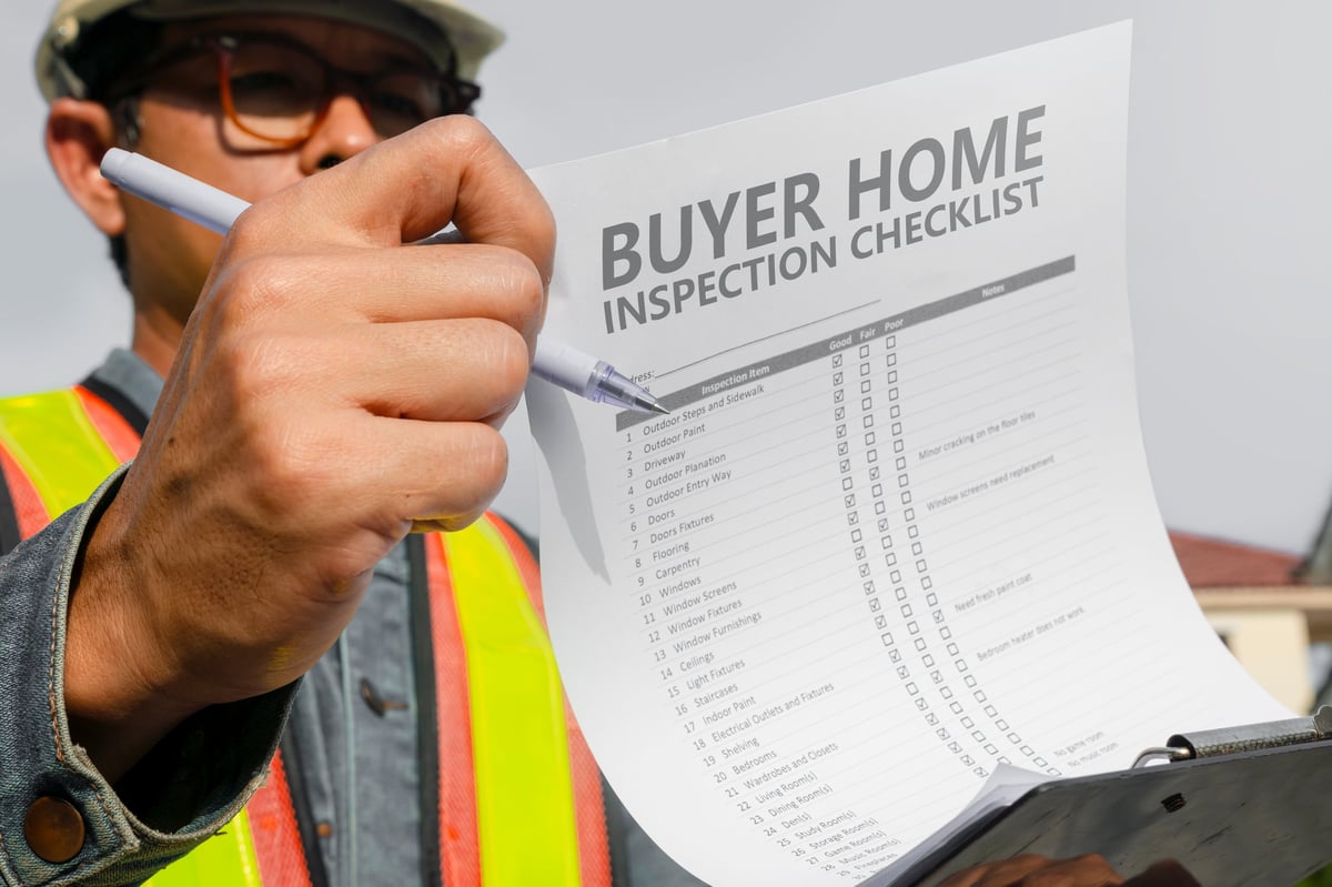 Inspector checking building structure and construction specifications