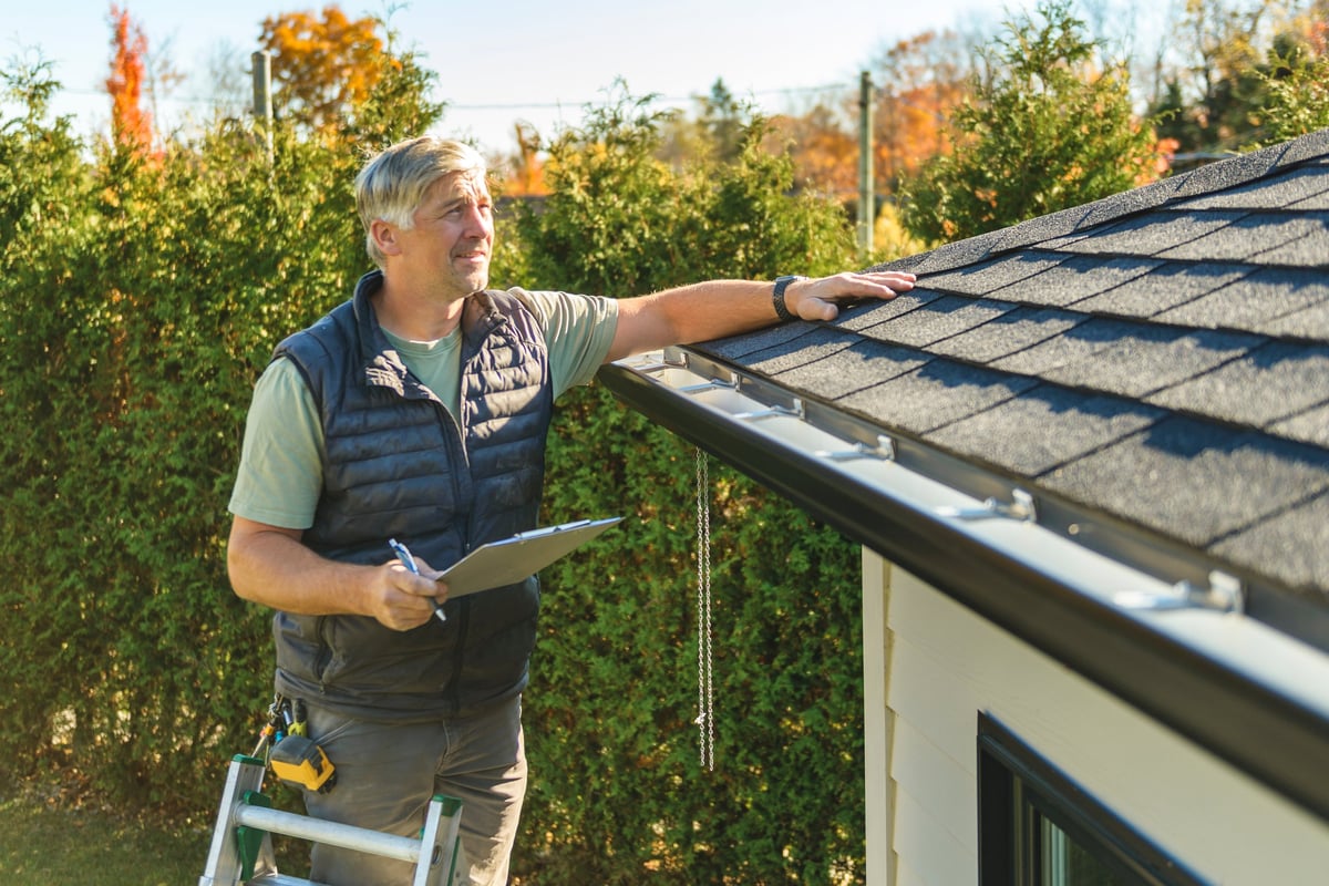 Certified inspector examining the roof of a Florida home